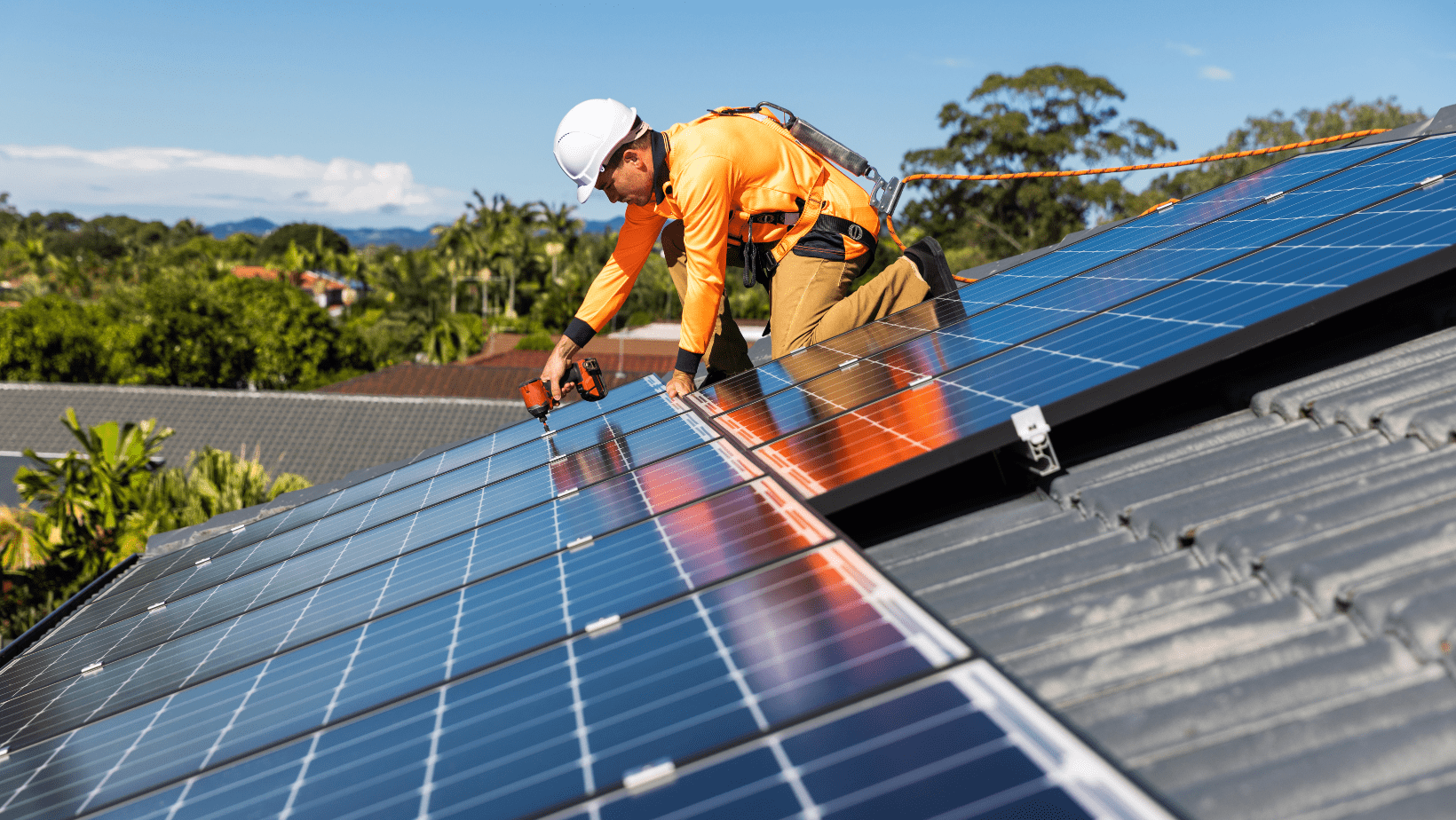Certified technician installing solar panels on a residential roof in an HOA-governed neighborhood