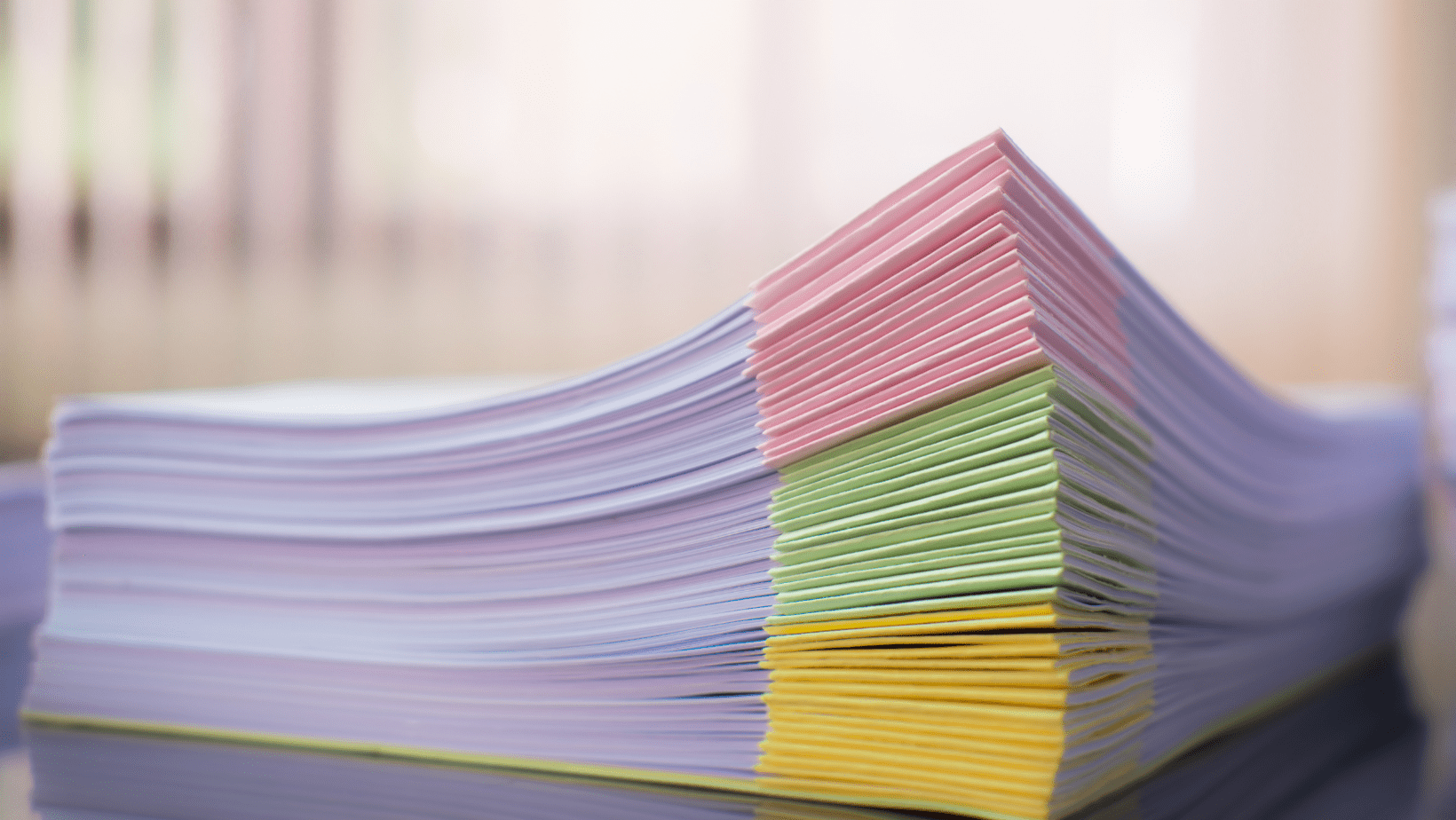 Stack of HOA documents and proposed amendments awaiting review